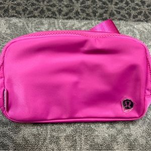 Lululemon pink cross body bag with two different zipper compartments.  Brand new